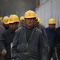 Chinesische Fabrikarbeiter. Industrieschäden werden auch wegen der globalen Vernetzung der Lieferketten immer teurer (Symbolbild). Industrieversicherung - Die wichtigsten Ursachen für teure Haftpflicht-Schäden